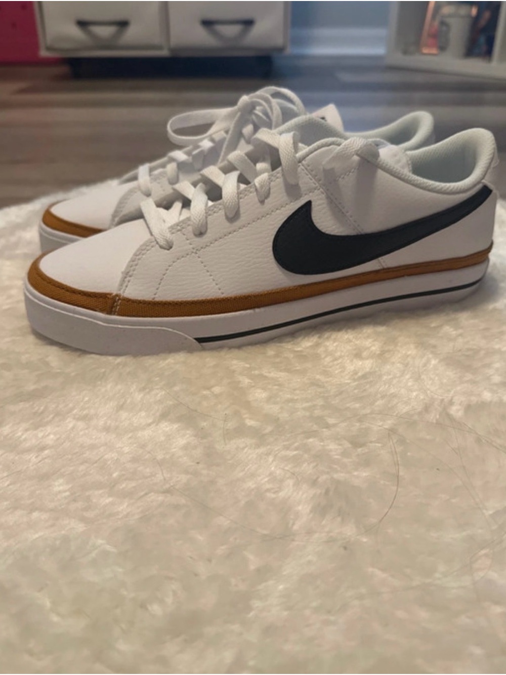 Nike White Low-Top Sneakers with Black Swoosh and Brown Trim